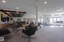 Spacious common area featuring recessed lighting and a decorative ceiling grid - 