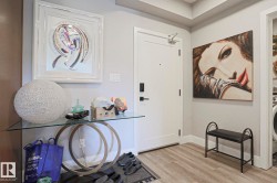 Entryway featuring light wood-finish flooring and neutral wall tones - 