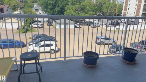 Private balcony with concrete flooring and metal railings - 311 8604 Gateway Boulevard, Edmonton, AB 