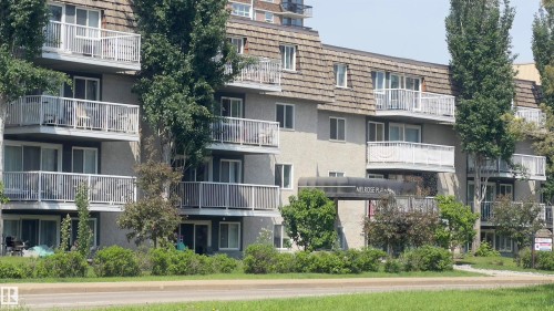 Multi-story residential building featuring a textured facade and private balconies - 311 8604 Gateway Boulevard, Edmonton, AB 