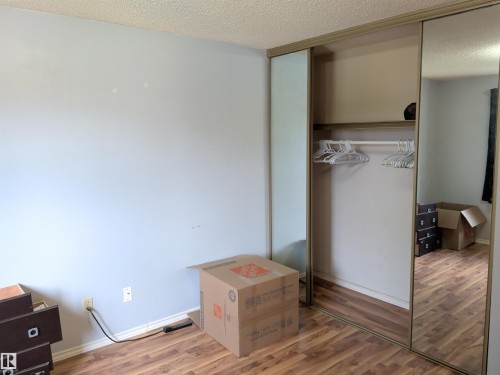 Sliding mirrored closet doors providing extensive storage space - 2724 105 Street Nw, Edmonton, AB - Indoor