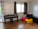 Room featuring wood-finish flooring, a double window, and a sliding glass door - 2724 105 Street Nw, Edmonton, AB  - Indoor 