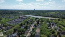 Aerial perspective of a residential neighborhood featuring established homes with varying rooflines - 10173 93 Street, Edmonton, AB 