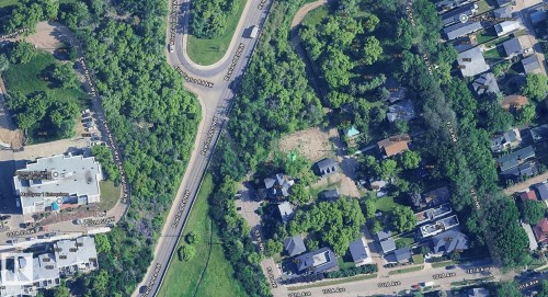 Aerial perspective showcasing a residential area with varied property types, including single-family homes and multi-story buildings - 10173 93 Street, Edmonton, AB 
