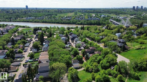 Aerial perspective showcasing a residential neighborhood with mature tree coverage - 10173 93 Street, Edmonton, AB 