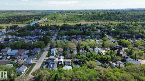 Expansive aerial perspective showcasing a residential area with a verdant tree canopy - 10173 93 Street, Edmonton, AB 