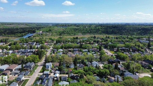 Aerial perspective showcasing a residential area with mature trees and established homes - 10173 93 Street, Edmonton, AB 