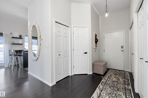 Foyer entrance with dark wood finished floors - 302 10905 109 Street, Edmonton, AB 