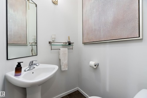 Bathroom featuring toilet and baseboards - 302 10905 109 Street, Edmonton, AB 
