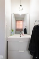 Compact bathroom vanity featuring an integrated basin, chrome faucet, and two storage drawers - 