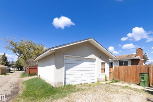 Detached garage with a single overhead door and stucco exterior - 7115 39A Avenue, Edmonton, AB - Outdoor With Exterior