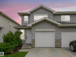 Gray siding exterior with stone accents - 