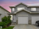 Gray siding exterior with stone accents - 18 230 Edwards Drive, Edmonton, AB 