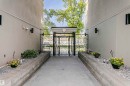 Wrought iron gate with ornate detailing opening to an exterior walkway - 211 10808 71 Avenue, Edmonton, AB 