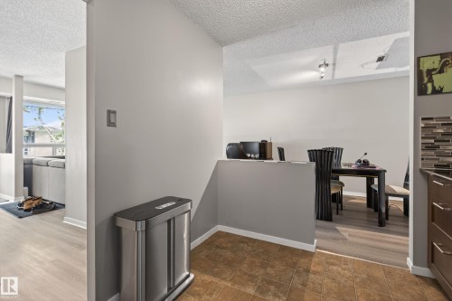 Open-concept living space with light wood-finish flooring - 35 3111 142 Avenue, Edmonton, AB 