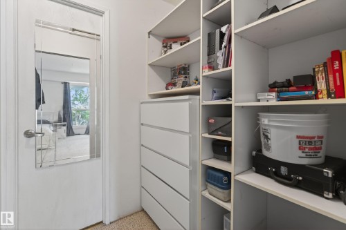Custom closet system featuring open shelving and built-in drawers - 35 3111 142 Avenue, Edmonton, AB 