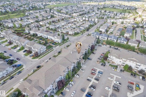 Multi-story residential building with private balconies and surface parking - 3302 9351 Simpson Drive, Edmonton, AB 