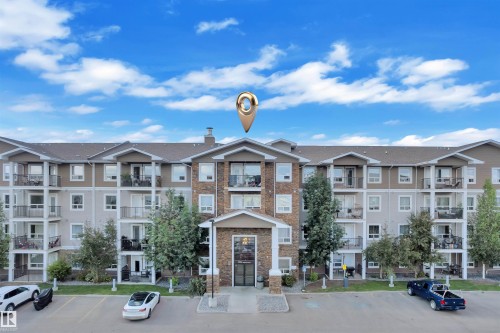 Multi-story residential building with stone and siding exterior accents - 3302 9351 Simpson Drive, Edmonton, AB 