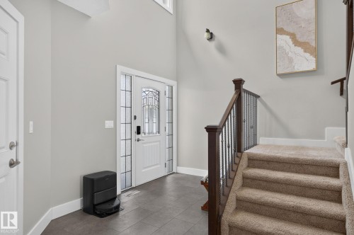Foyer entry featuring a decorative glass paneled door with sidelights and transom window - 14016 161 Avenue, Edmonton, AB 