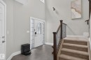 Foyer entry featuring a decorative glass paneled door with sidelights and transom window - 14016 161 Avenue, Edmonton, AB 