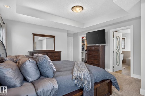 Recessed ceiling with an overhead light fixture and a built-in closet with shelving - 14016 161 Avenue, Edmonton, AB 