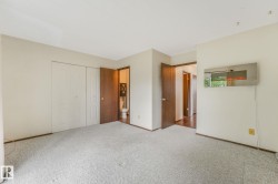 Primary bedroom featuring a 2 piece ensuite and Juliet style balcony. - 
