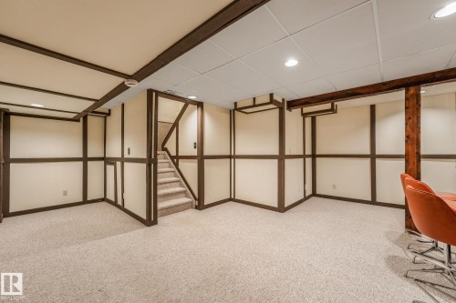 Carpeted recreational room with recessed lighting and a drop ceiling - 2921 130 Avenue, Edmonton, AB 