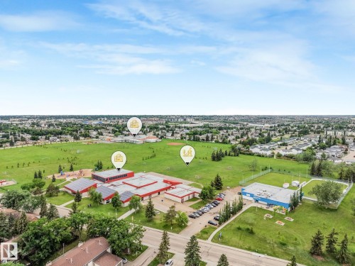 Aerial view of nearby Overlanders School and park featuring a baseball pitch, soccer field and jungle gym. Also nearby is the Edmonton East Soccer Dome. - 2921 130 Avenue, Edmonton, AB 