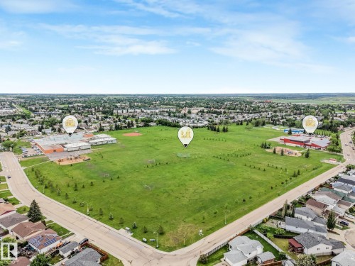 Aerial view of nearby Overlanders School and park featuring a baseball pitch, soccer field and jungle gym. Also nearby is the Edmonton East Soccer Dome. - 2921 130 Avenue, Edmonton, AB 