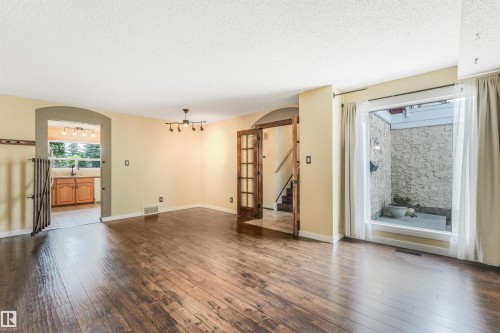 Family Room with gleaming hardwood floors. - 2921 130 Avenue, Edmonton, AB 