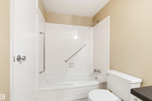 Tub and shower combination featuring white square tile surround - 2005 Saddleback Road, Edmonton, AB - Indoor Photo Showing Bathroom