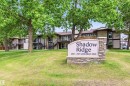 Stone-clad monument sign featuring property branding - 2005 Saddleback Road, Edmonton, AB  - Outdoor 