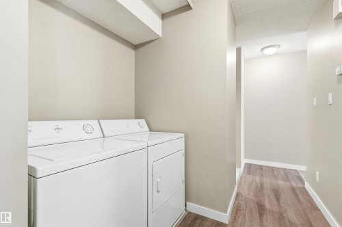 Dedicated laundry area featuring a white top-load washer and dryer set - 2005 Saddleback Road, Edmonton, AB - Indoor Photo Showing Laundry Room