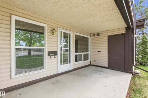 Covered concrete patio with horizontal siding facade - 2005 Saddleback Road, Edmonton, AB - Outdoor With Deck Patio Veranda With Exterior