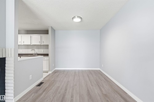 Open-concept area featuring wood-finish flooring, light blue wall paint, and recessed ceiling lighting - 2005 Saddleback Road, Edmonton, AB - Indoor