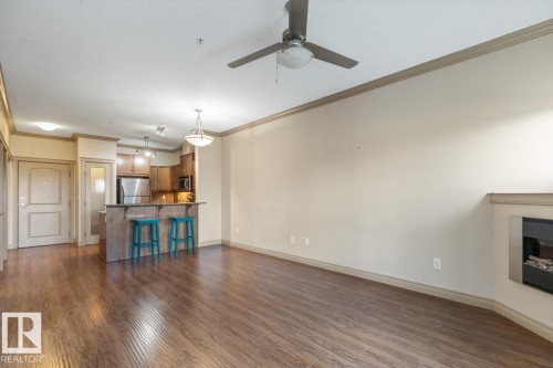 241 10121 80 Avenue, Edmonton, AB - Indoor Photo Showing Living Room With Fireplace