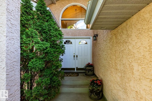 Double entry doors with arched transom window - 315 Osland Place, Edmonton, AB 