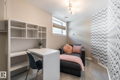 Dedicated workspace featuring a built-in desk with shelving - 315 Osland Place, Edmonton, AB 