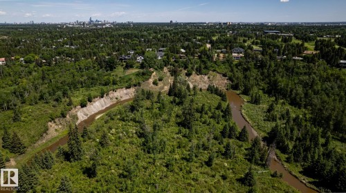 Meandering river system through a heavily wooded landscape with residential properties interspersed - 315 Osland Place, Edmonton, AB 