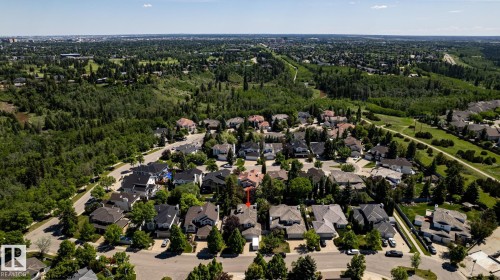 Residential area featuring mature trees and established homes, bordered by extensive green spaces and wooded areas - 315 Osland Place, Edmonton, AB 