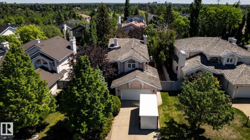 Aerial perspective showcasing a residential property with a light-toned exterior and a brown shingle roof - 315 Osland Place, Edmonton, AB 