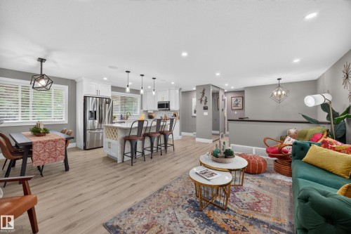 Open-concept living space featuring wood-finish flooring - 43 Burnham Place, St. Albert, AB 