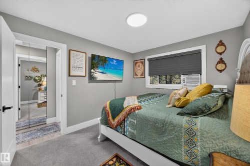 Bedroom featuring soft gray wall paint, carpeting, and a window with blinds - 43 Burnham Place, St. Albert, AB 