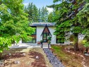 Contemporary split-level residence featuring white brick and dark wood-paneled siding - 43 Burnham Place, St. Albert, AB 