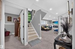 Carpeted lower level featuring a light gray color palette - 