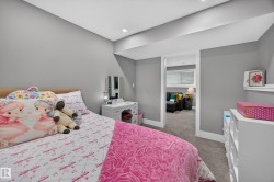 Carpeted room with recessed lighting and neutral wall paint - 