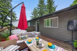 Spacious wood deck featuring a built-in railing - 