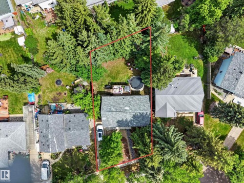 Aerial perspective showcasing a property defined by a red boundary - 43 Burnham Place, St. Albert, AB 