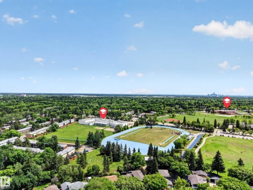 Aerial perspective showcasing a broad expanse of green space and mature tree canopy - 43 Burnham Place, St. Albert, AB 
