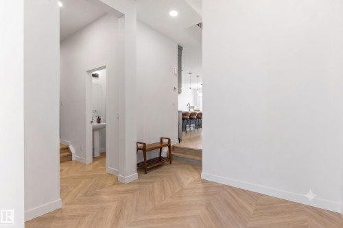 Herringbone wood-finish flooring throughout the entryway - 117 Paisley Gate Gate, Edmonton, AB 